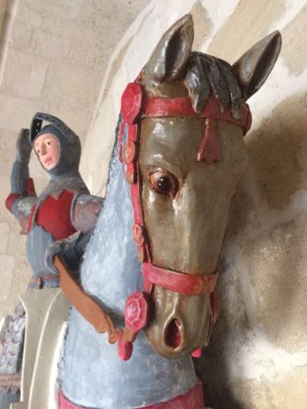 PHOTO: The wooden carving of St George on horseback, fighting a dragon, is held at St Michael's Church. (Facebook: ArtUs Restauracion Patrimonio)
